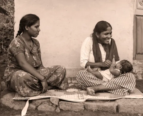 Holding-4-months-home-delilvered-tribal-baby